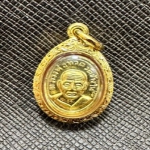 หลวงพ่อทวดเม็ดแตงเนื้อทองคำ no.14 เลี่ยมทอง