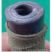 ตะกรุดเนื้อตะกั่วถักเชือกสีเขียว ยาวสี่นิ้วกว่า