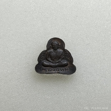 พระปิดตาหลังรูปเหมือนหลวงปู่ทิม เนื้อนวะ พ.ศ.2517