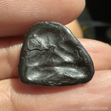 พระปิดตาเนื้อคลุกรักหลังแบบ