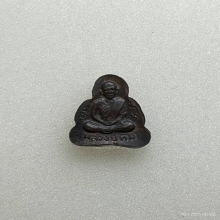 พระปิดตาหลังรูปเหมือนหลวงปู่ทิม เนื้อนวะ พ.ศ.2517